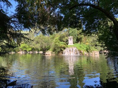 Pond with island and monument to the 3rd Duke of Osuna in El Capricho Park. Tour Time