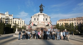 Company group posing in front of the Royal Palace of Madrid during an incentive trip